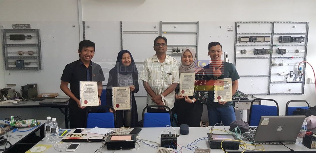 Founder Mr. Sunderasen presenting certificates to PLC training participants at ASASMY Johor Bahru